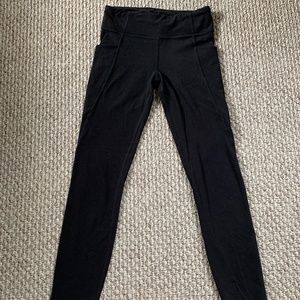Black Athleta Stash Your Treasures Leggings (size 12)